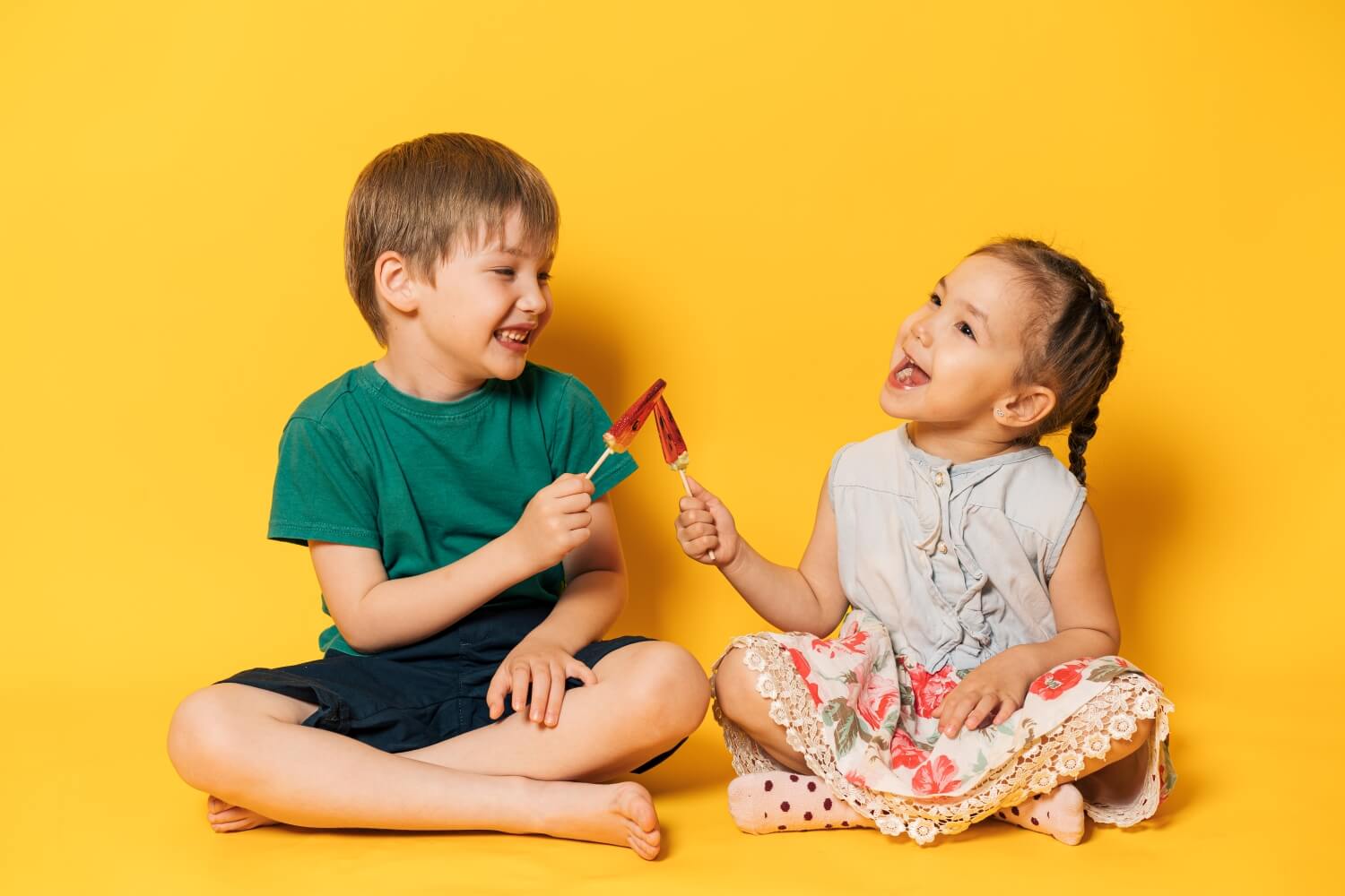 boy-and-girl-are-holding-watermelon-shaped-lollipo-2023-11-27-05-26-30-utc.jpg